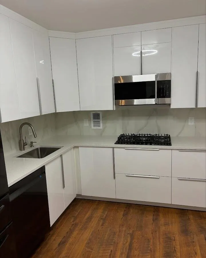 Restored kitchen with white cabinets after water damage in Doral